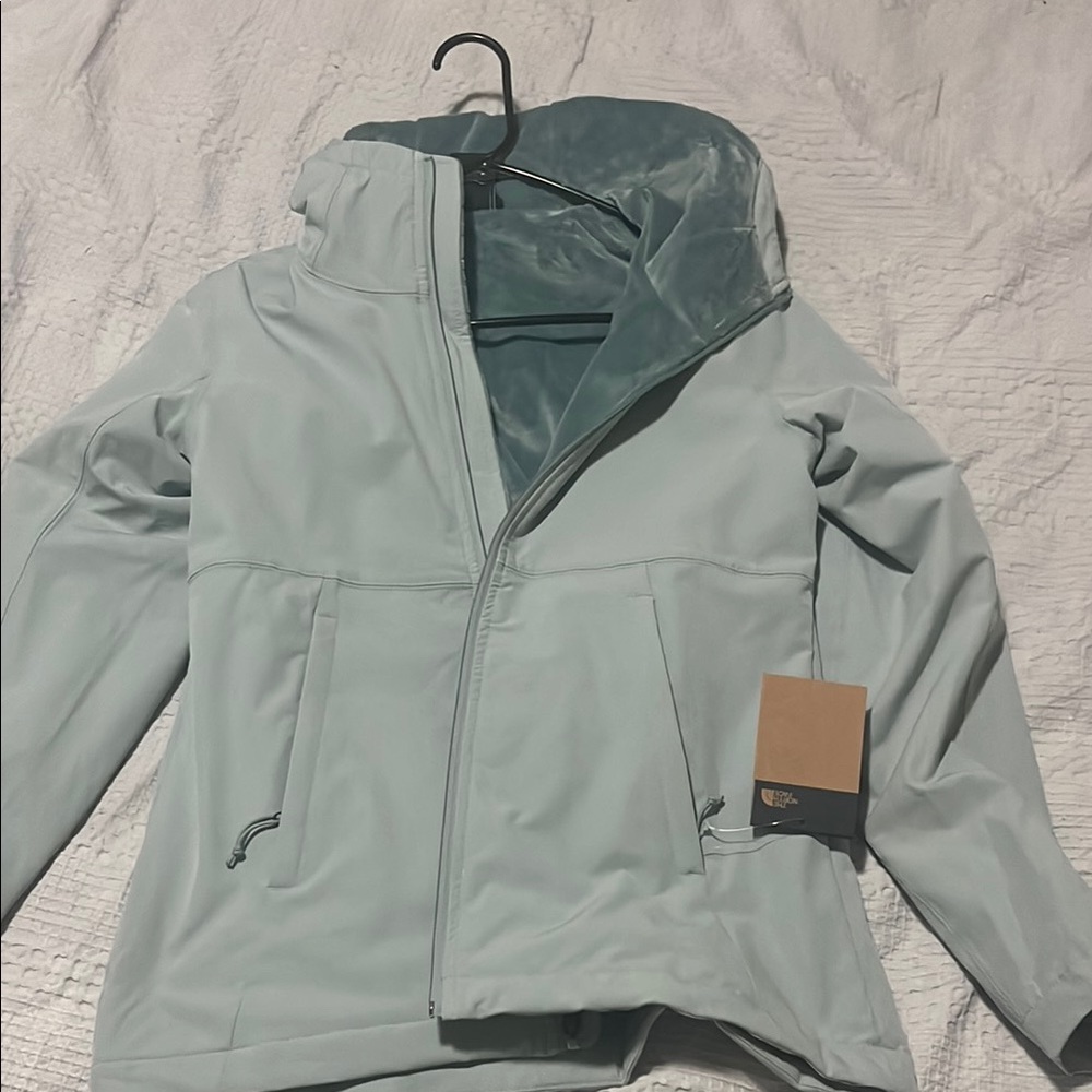 The North Face coat with a hood. Beautiful coat and never worn!